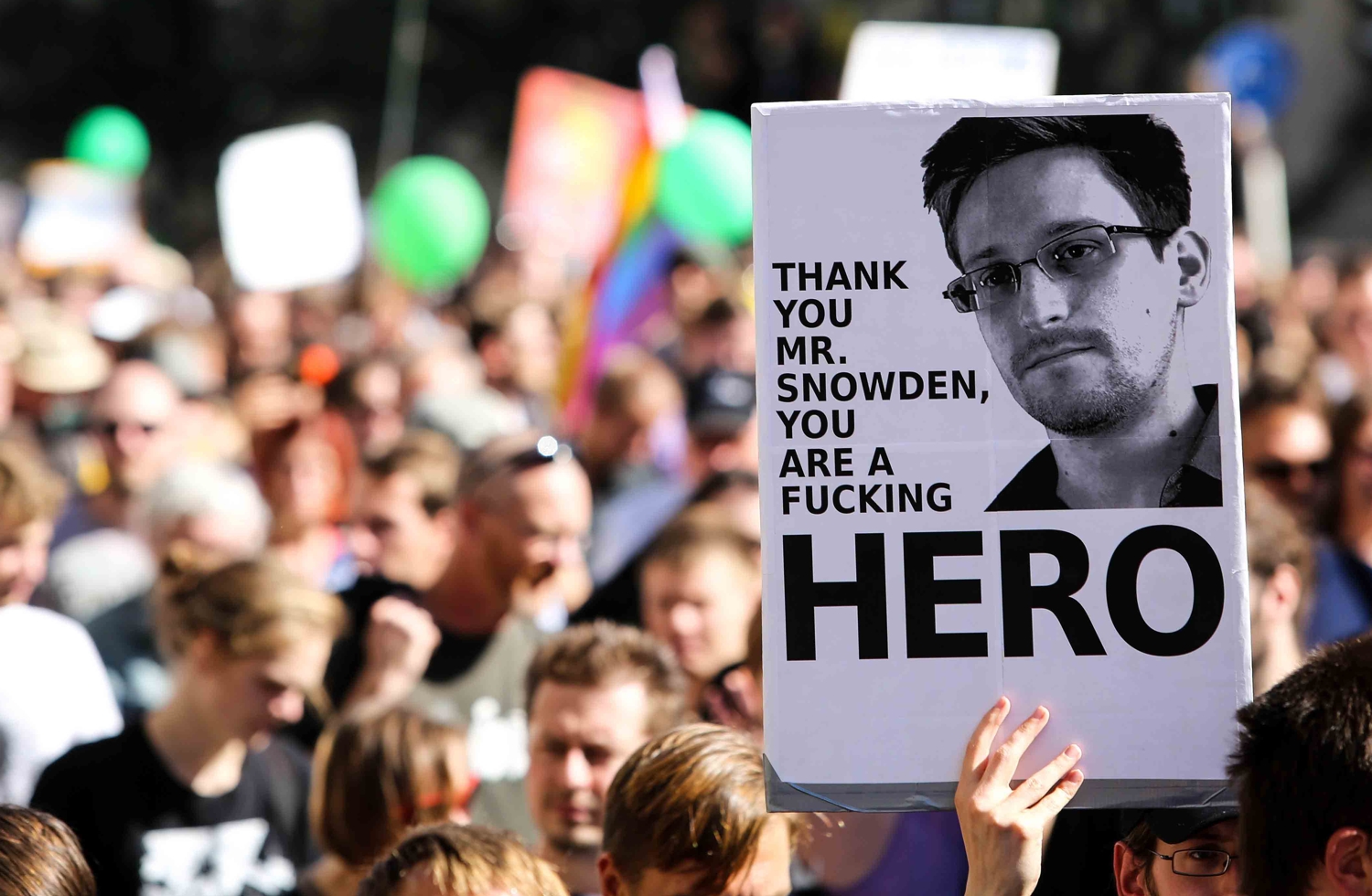 Protest sign reading ‘Thank you Mr. Snowden, you are a fucking hero
